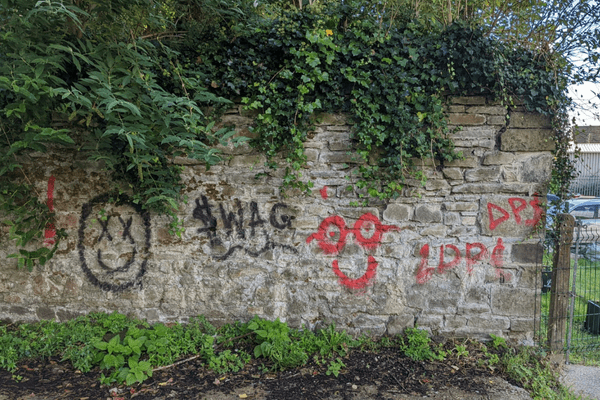 Graffiti and Paint on Stone Wall